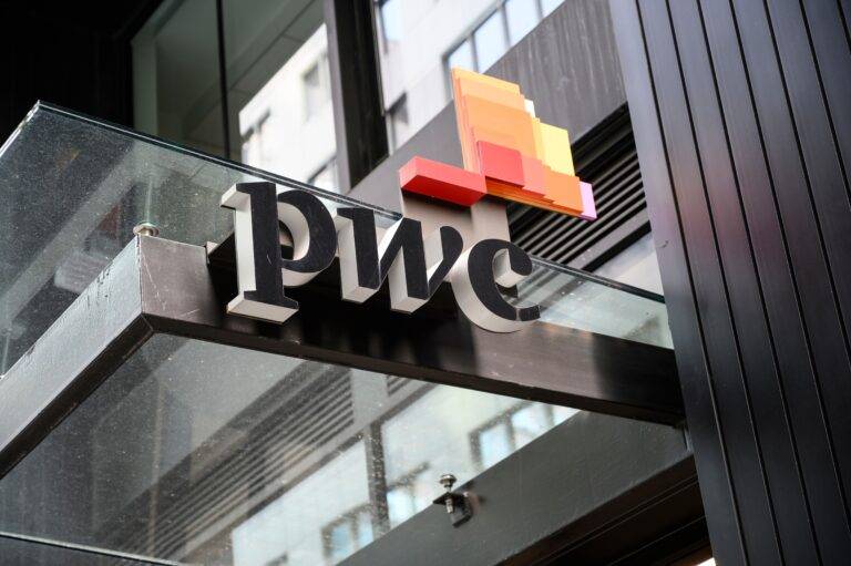 PriceWaterhouseCoopers logo on a building entrance in New York