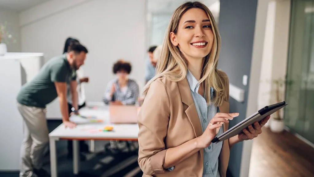 Smiling business woman leading a team