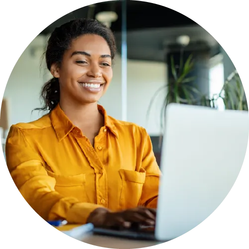 Smiling woman on laptop