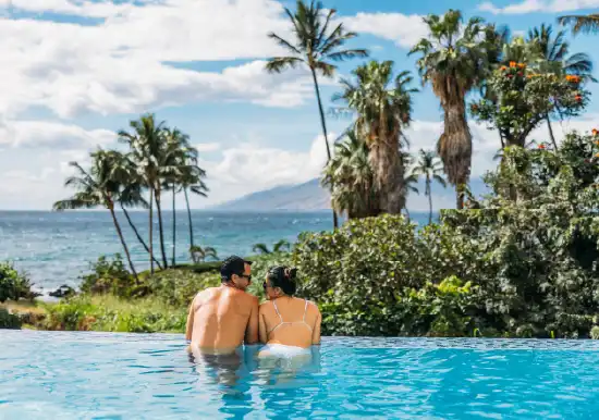 Couple Enjoying Pool and Ocean View at Wailea