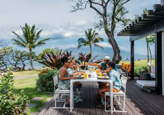 Family enjoying outdoor dining at Wailea