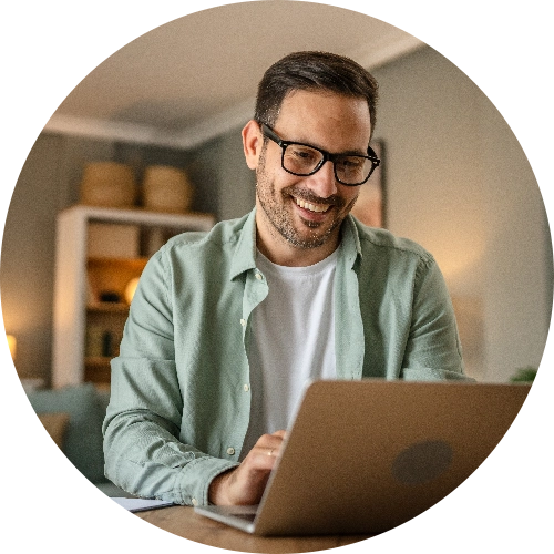 Smiling man on a laptop