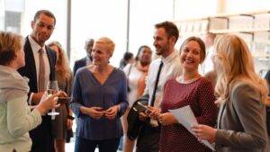 Professionals networking at an event.