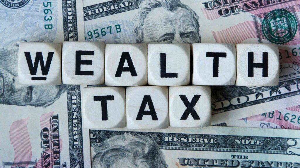 Dice spelling out wealth tax.