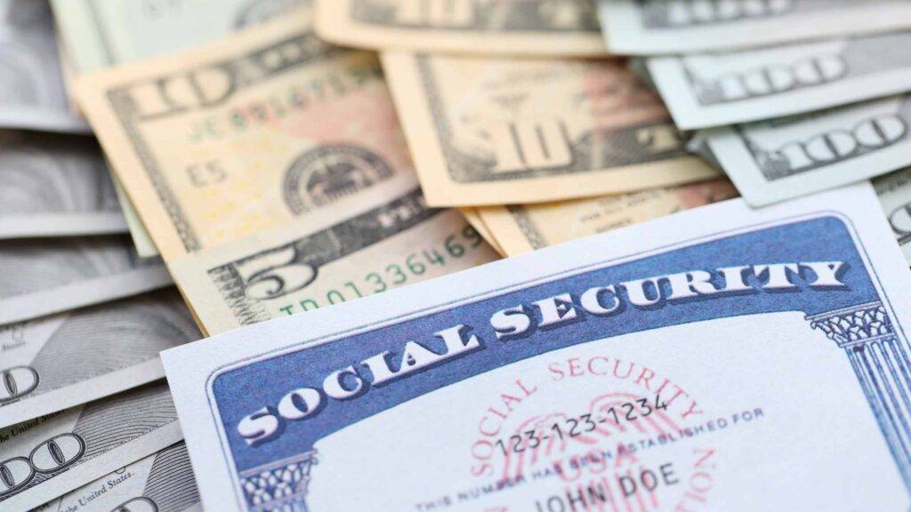 American US dollars money bills and US social security number card close up